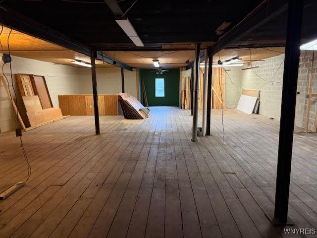 basement with wood-type flooring