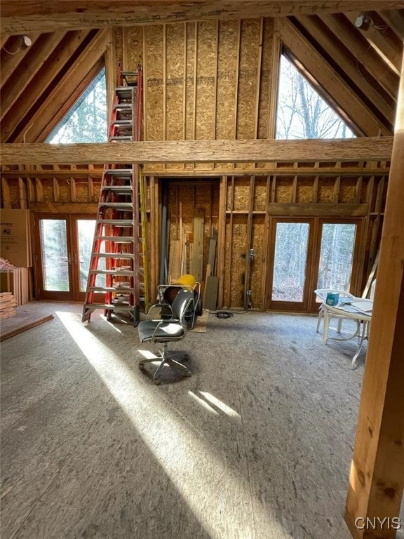 misc room featuring french doors and high vaulted ceiling