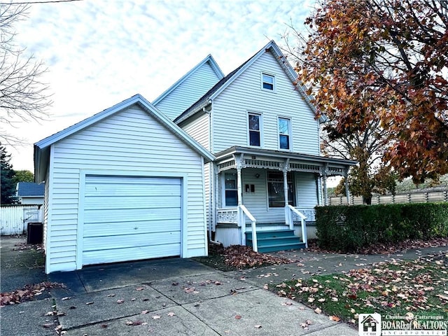 view of front of house featuring a porch and a garage