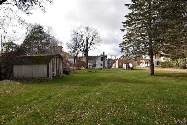 228 Main St, Theresa, NY 13691 - view of grassy yard featuring a shed