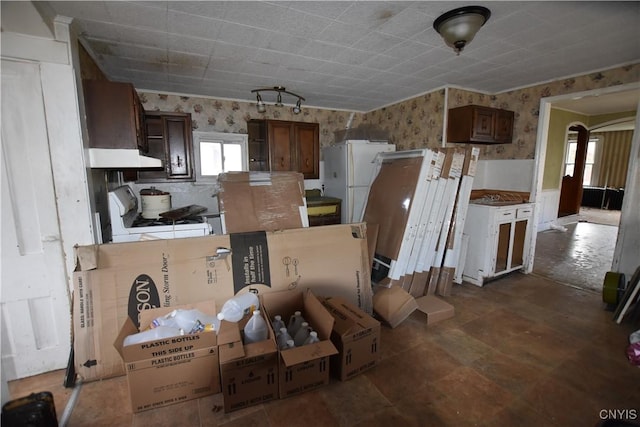 228 Main St, Theresa, NY 13691 - kitchen with wallpapered walls and white appliances
