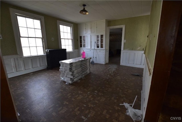 228 Main St, Theresa, NY 13691 - dining area featuring a decorative wall and wainscoting