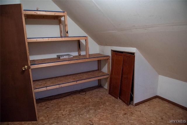 bonus room featuring lofted ceiling