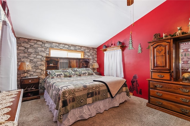 carpeted bedroom featuring vaulted ceiling and a ceiling fan