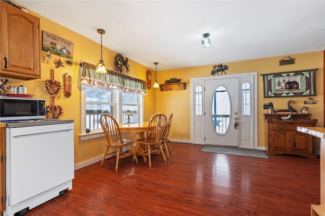 interior space with baseboards and dark wood finished floors