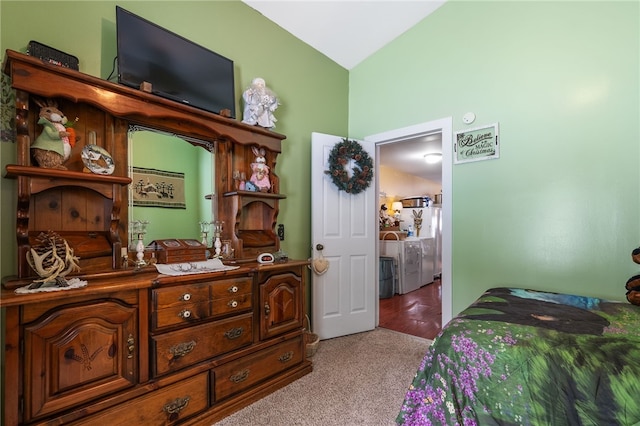 carpeted bedroom featuring separate washer and dryer