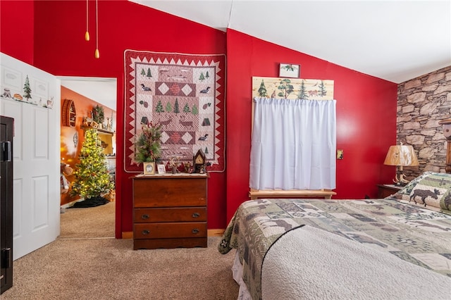 bedroom with lofted ceiling and carpet flooring