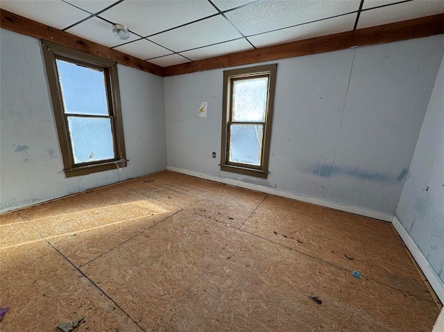 unfurnished room with a paneled ceiling