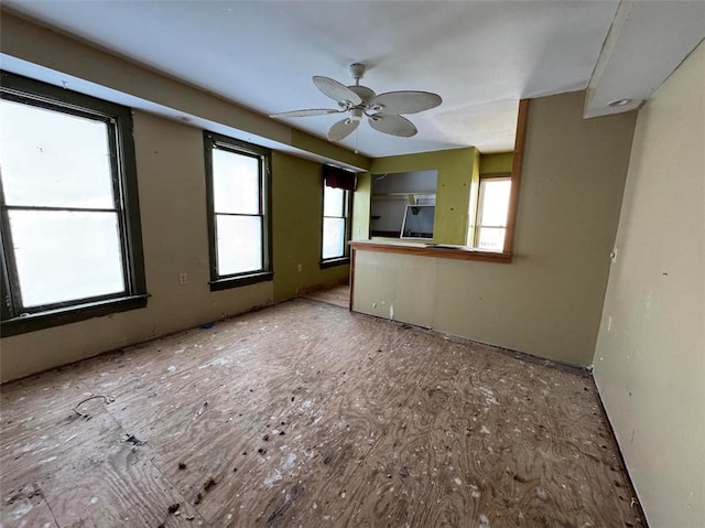 unfurnished room with ceiling fan