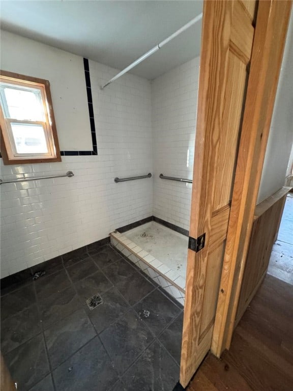 bathroom with a tile shower