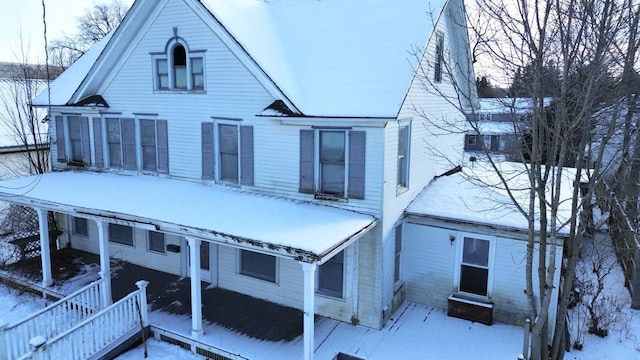 view of snow covered house