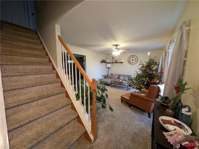 living room with ceiling fan and carpet floors