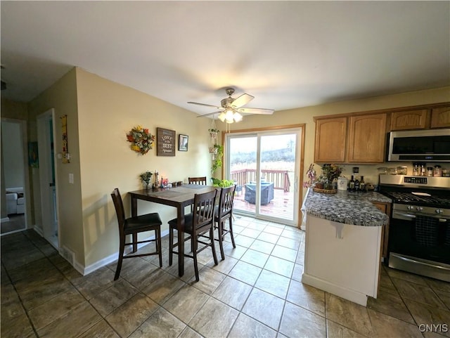 kitchen featuring stainless steel appliances and ceiling fan