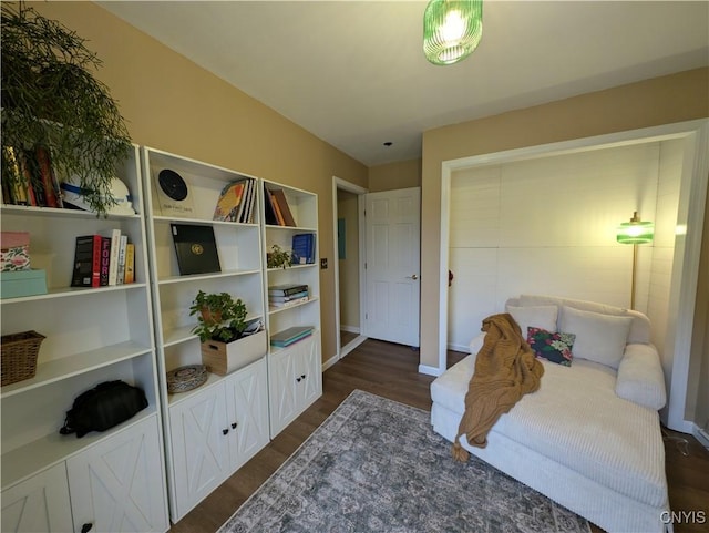 bedroom with dark hardwood / wood-style flooring