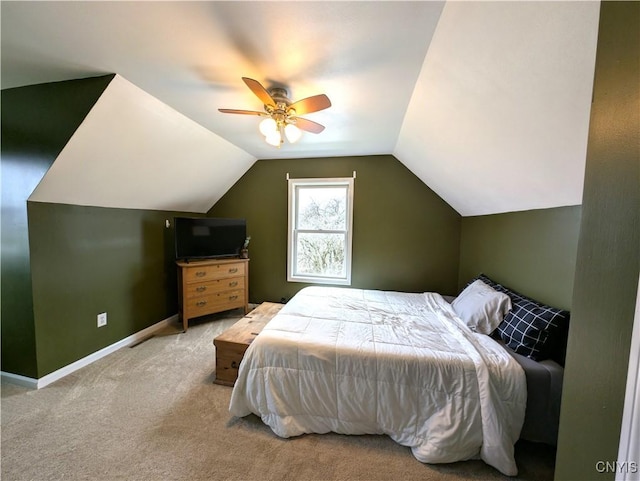 bedroom featuring ceiling fan, carpet, and lofted ceiling