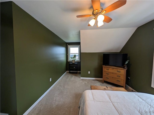 unfurnished bedroom featuring light colored carpet, ceiling fan, and lofted ceiling