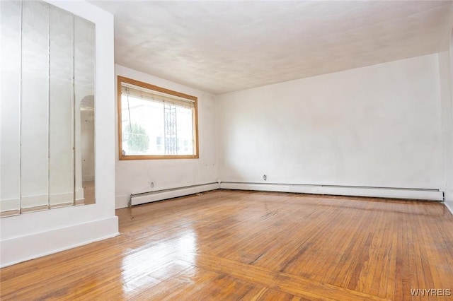 spare room with wood-type flooring