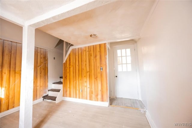 interior space featuring wooden walls and hardwood / wood-style flooring