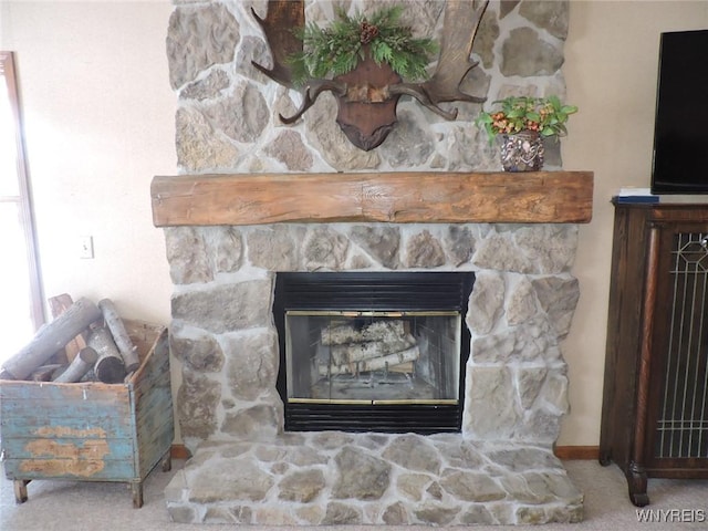 details with carpet floors and a stone fireplace