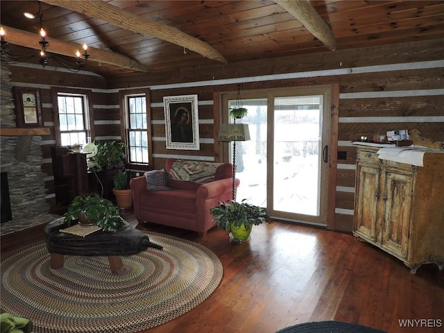 living room with vaulted ceiling with beams, wooden ceiling, and hardwood / wood-style flooring