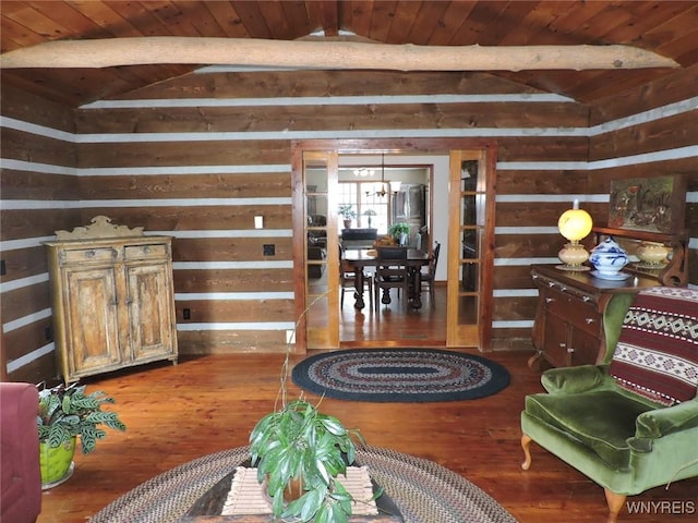 sitting room featuring dark hardwood / wood-style flooring, vaulted ceiling with beams, and wood ceiling