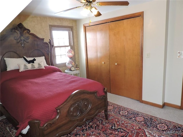 bedroom featuring ceiling fan, carpet floors, and a closet