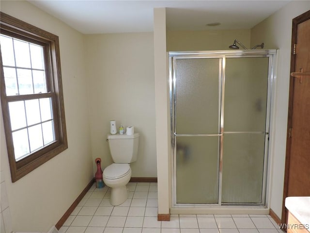 bathroom with tile patterned floors, an enclosed shower, and toilet