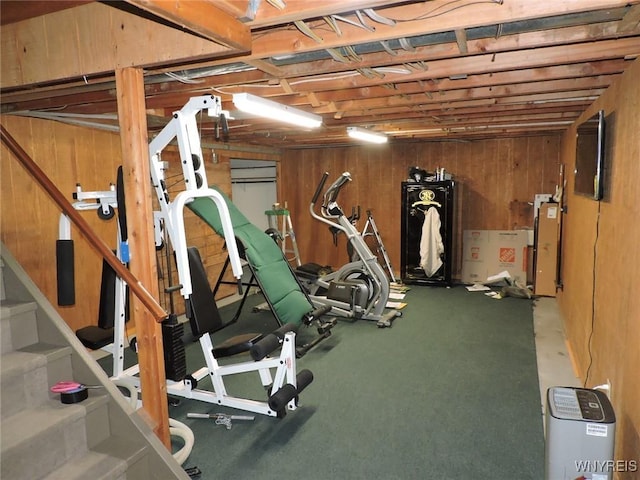 workout room with wood walls