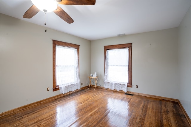 unfurnished room with hardwood / wood-style floors and ceiling fan