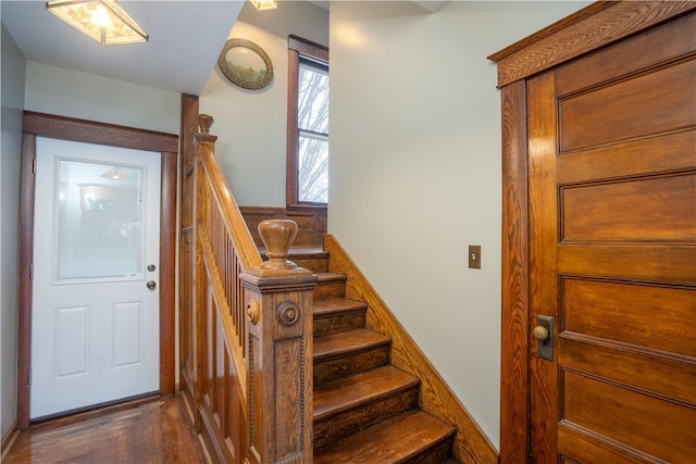 staircase featuring wood-type flooring