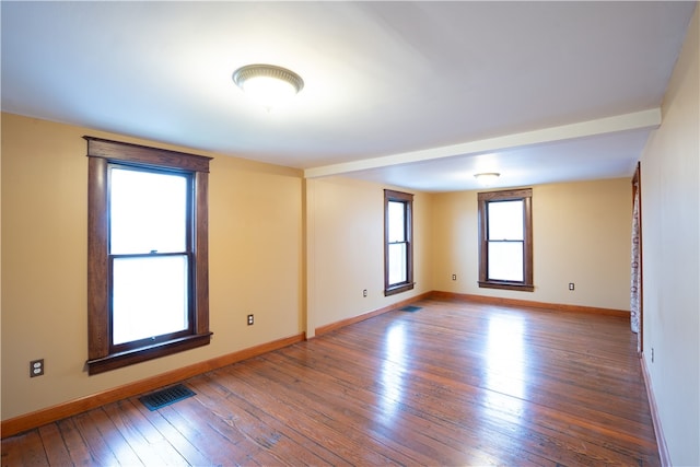 unfurnished room featuring wood-type flooring