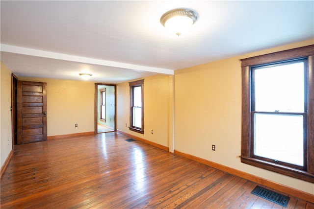 empty room with wood-type flooring