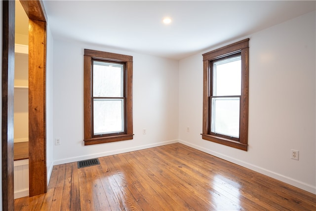 spare room featuring hardwood / wood-style floors