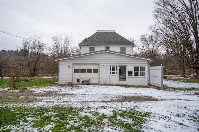 view of snow covered garage