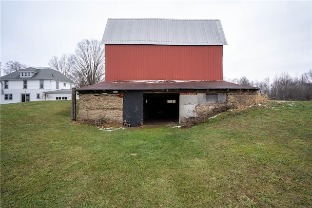 view of outbuilding featuring a yard