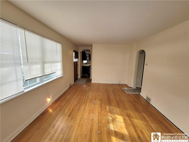 unfurnished living room with light wood-type flooring