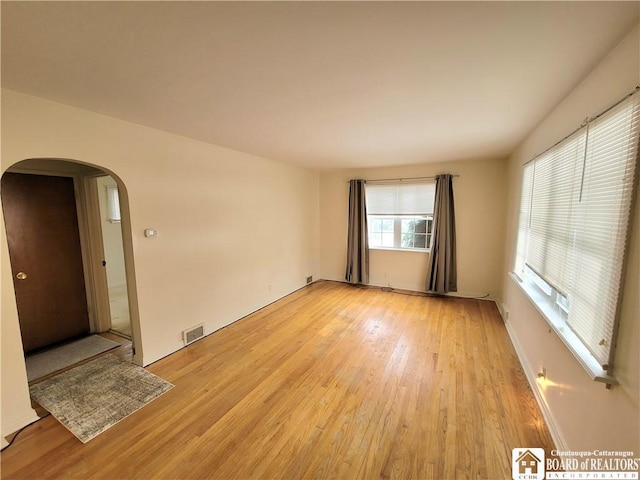 empty room with light hardwood / wood-style floors