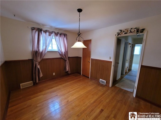 empty room featuring hardwood / wood-style flooring