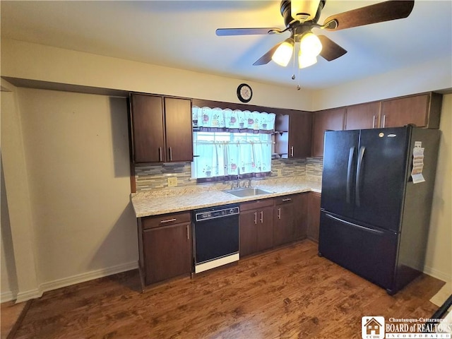 kitchen featuring decorative backsplash, sink, dark brown cabinetry, and black appliances