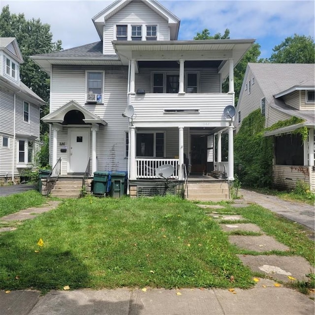 view of front of property featuring a porch and a front lawn