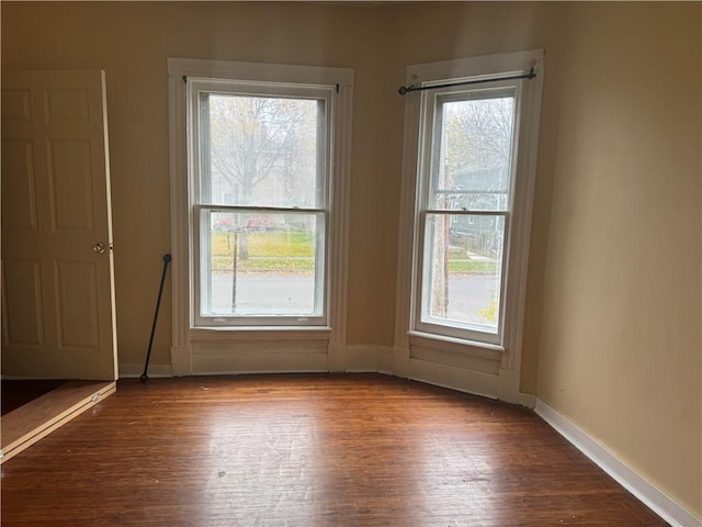 entryway with wood-type flooring and a healthy amount of sunlight