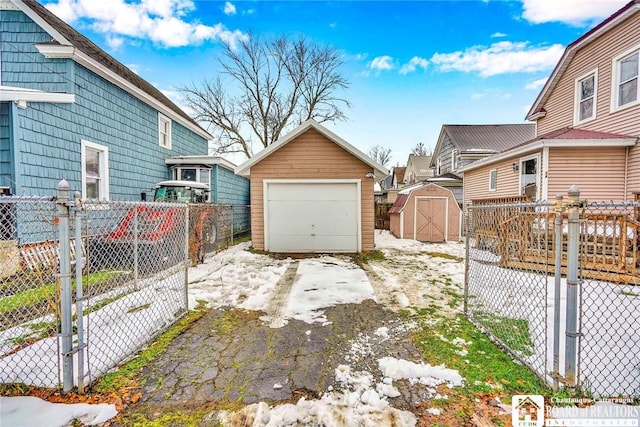 exterior space with a garage and a storage shed