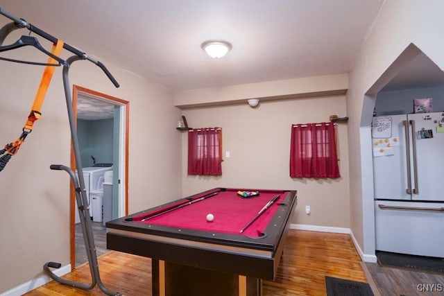 rec room featuring washing machine and clothes dryer, dark hardwood / wood-style flooring, and billiards