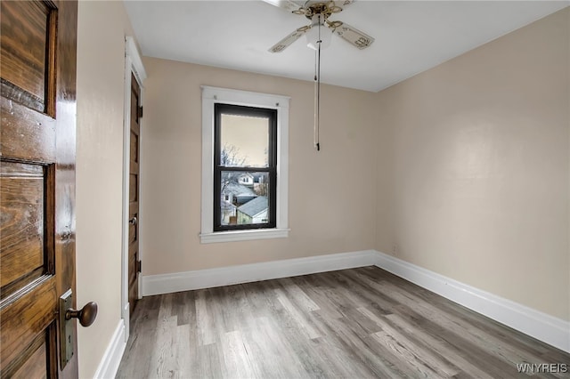 spare room featuring ceiling fan and light wood-type flooring