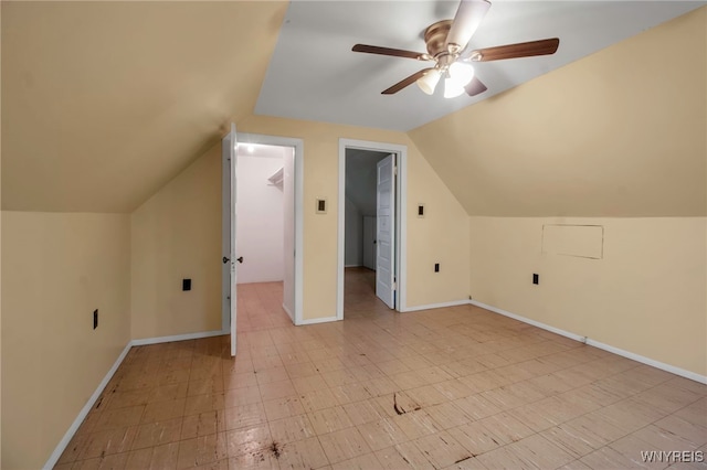 bonus room with ceiling fan and lofted ceiling