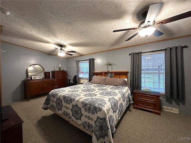 bedroom featuring a textured ceiling, carpet floors, and ceiling fan