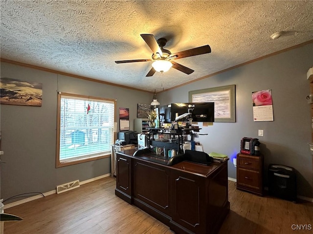 office area featuring hardwood / wood-style floors, a textured ceiling, and ornamental molding