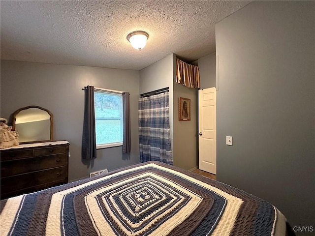 bedroom featuring a textured ceiling