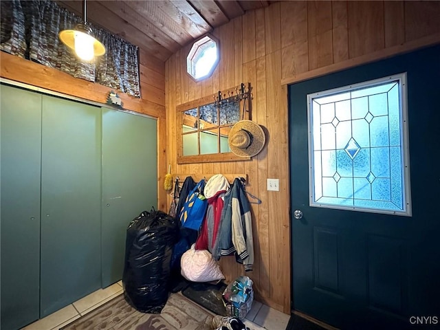 interior space featuring wooden walls and wooden ceiling