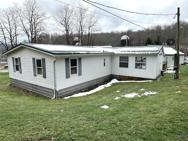 back of house with a yard